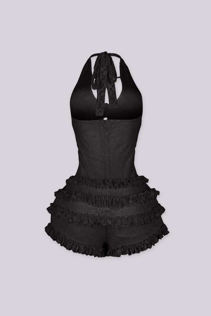 Fitted bodice halter romper with deep V neckline featuring vertical teardrop keyhole cutout and seashell beads embellishments
Micro mini shorts featuring overlaid with horizontal tiers of ruffle detailing