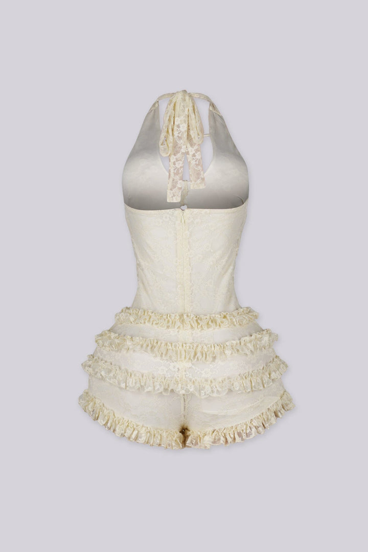 Fitted bodice halter romper with deep V neckline featuring vertical teardrop keyhole cutout and seashell beads embellishments
Micro mini shorts featuring overlaid with horizontal tiers of ruffle detailing