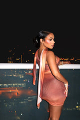 sheer peach colored mini dress with a matching long scarf drape shoulder