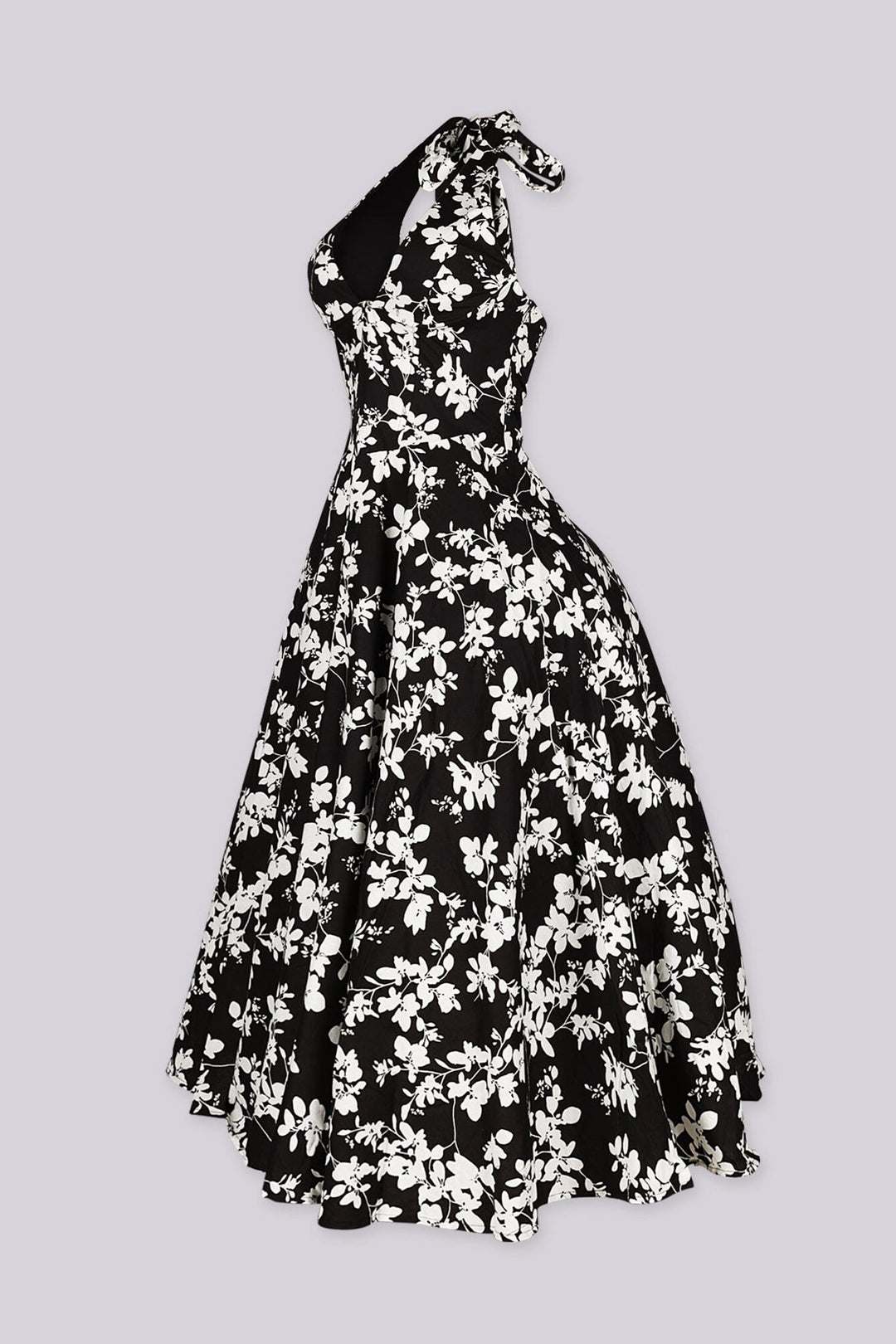 EDGE — black and ivory floral print halter midi dress, side view flat lay