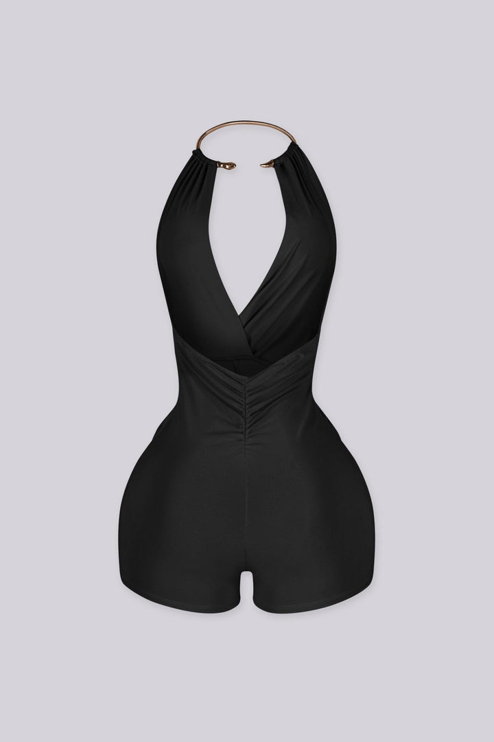 Deep plunging halter romper with snake rhinestone choker detailing
Ruched front with adjustable drawstring and sculpted bodycon fit