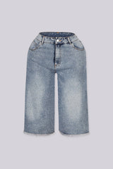 Wide denim bermuda shorts with frayed hem featuring rhinestone embellishments throughout&amp;nbsp;
