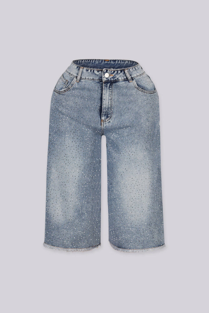 Wide denim bermuda shorts with frayed hem featuring rhinestone embellishments throughout&amp;nbsp;