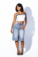 Wide denim bermuda shorts with frayed hem featuring rhinestone embellishments throughout&amp;nbsp;
