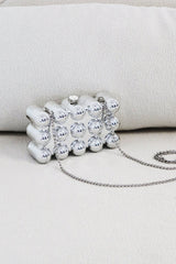EDGE — silver bubble-textured mini clutch, angled flat lay