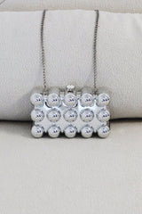 EDGE — silver bubble-textured mini clutch, front view flat lay