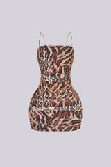Mesh leopard print ruched mini dress featuring all over rhinestone embellishments