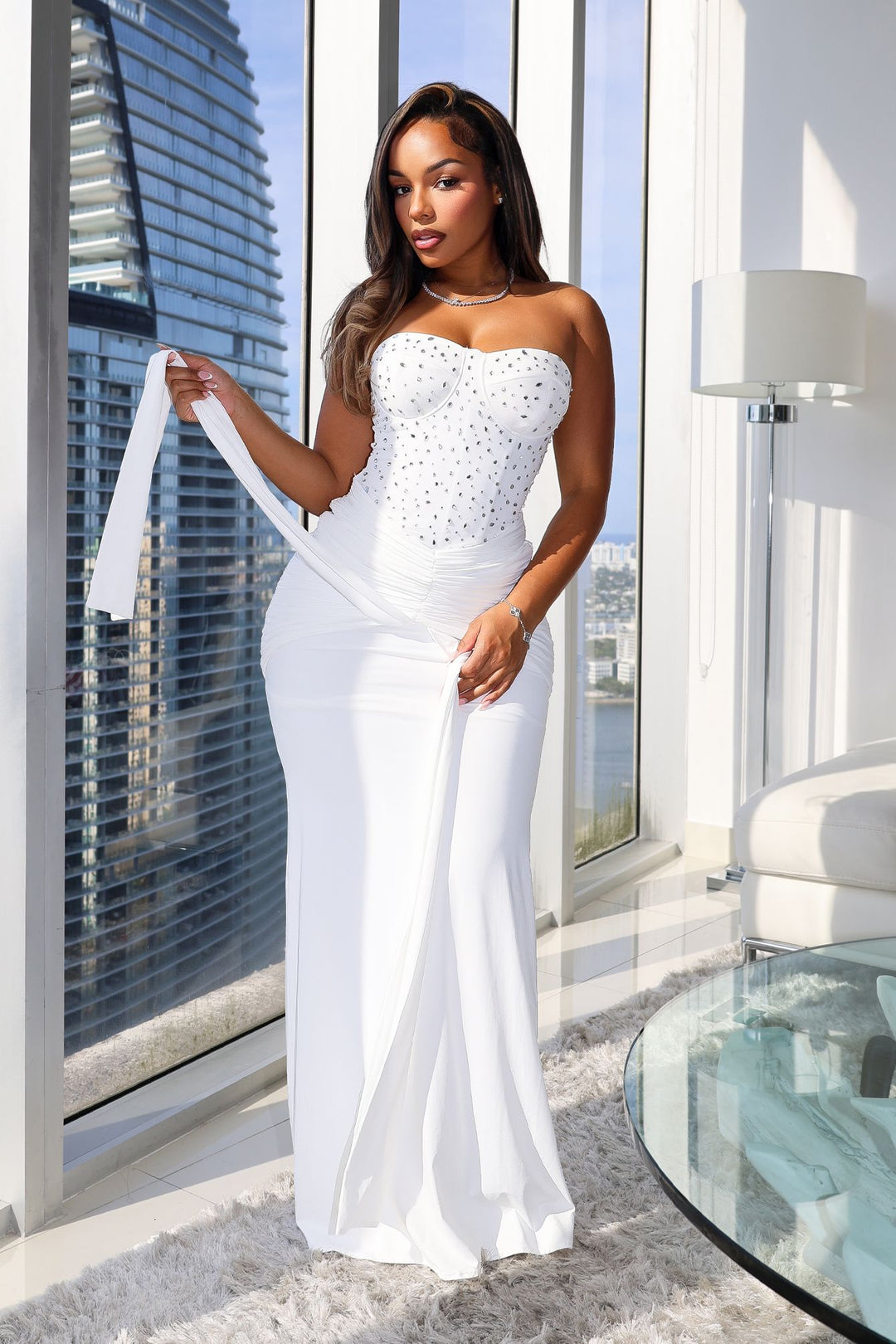 Strapless maxi gown with scattered crystal and rhinestone embellishment throughout the bodice