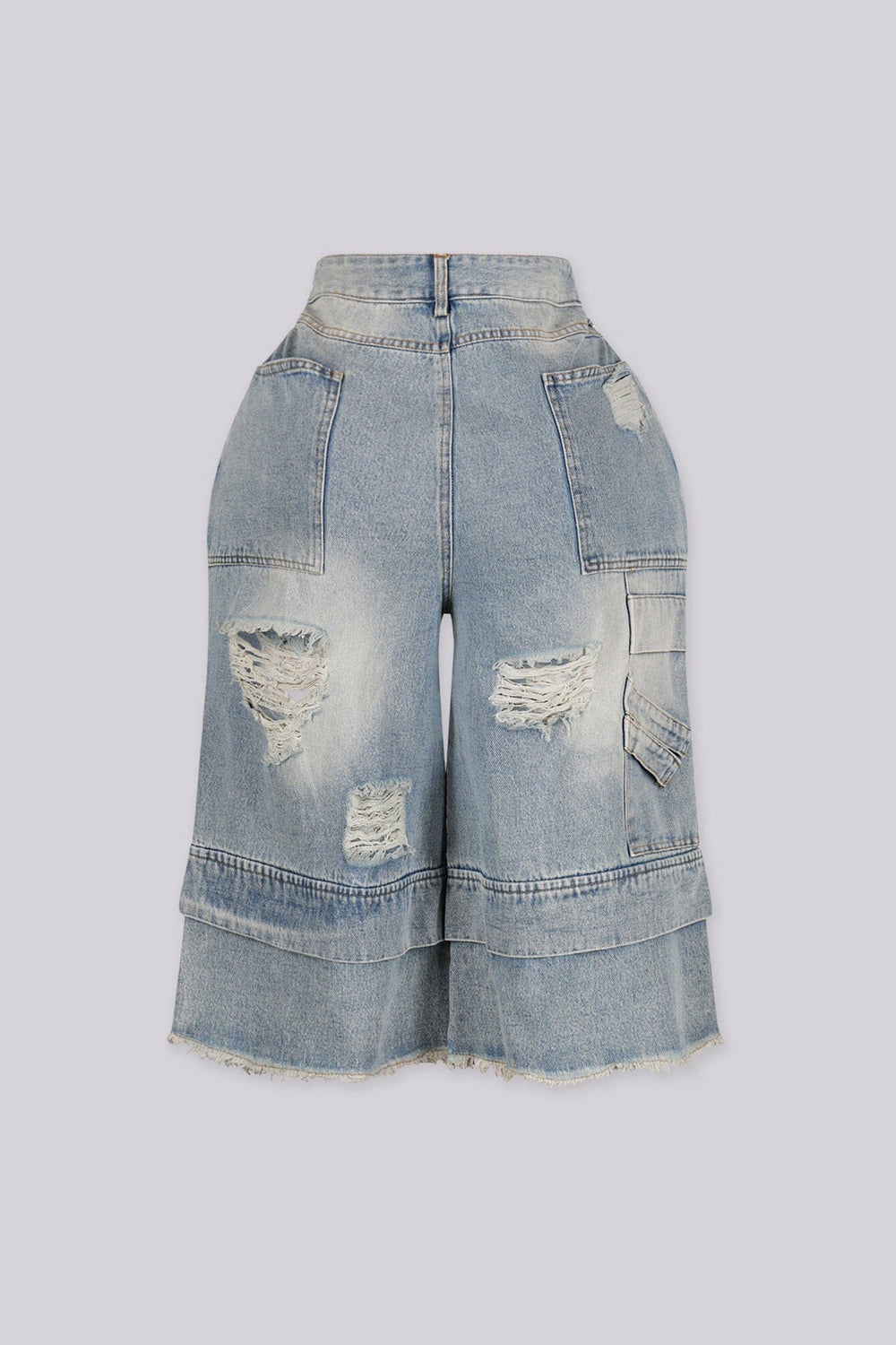 High rise wide leg bermuda denim shorts with distressed rips and frayed patches, back view