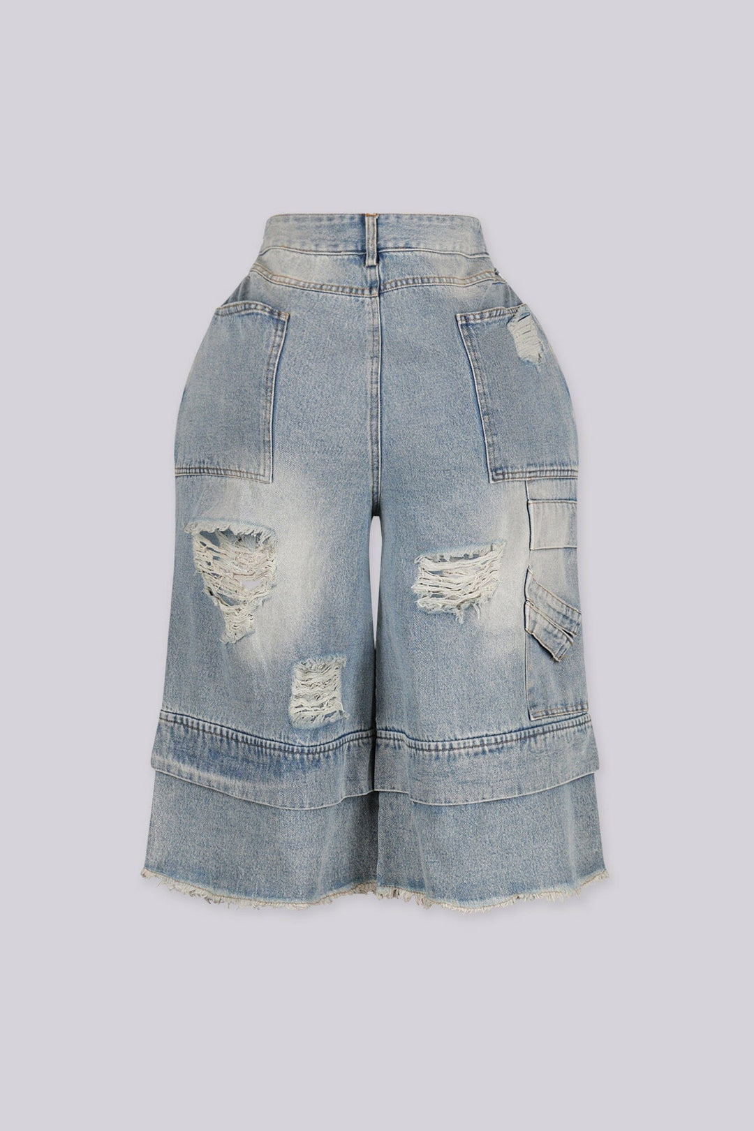 High rise wide leg bermuda denim shorts with distressed rips and frayed patches, back view