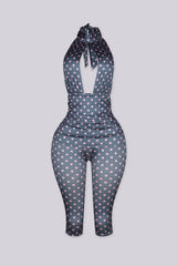 Polka dot pattern high halter neck jumpsuit with a keyhole cutout at the front chest