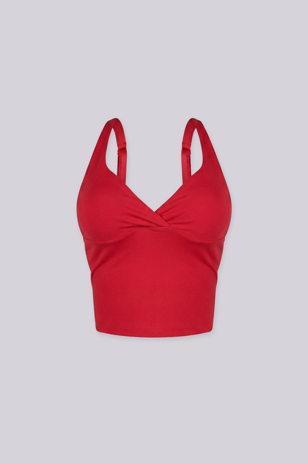 Cropped tank top featuring a flattering sweetheart neckline and padded bustier with adjustable straps
