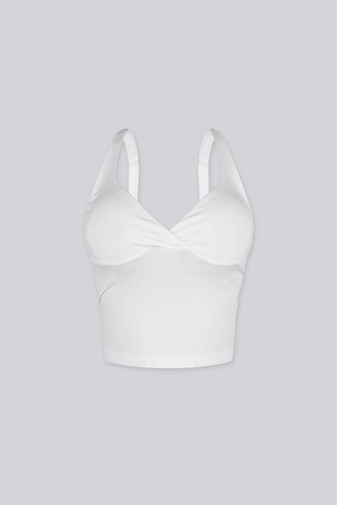 Cropped tank top featuring a flattering sweetheart neckline and padded bustier with adjustable straps