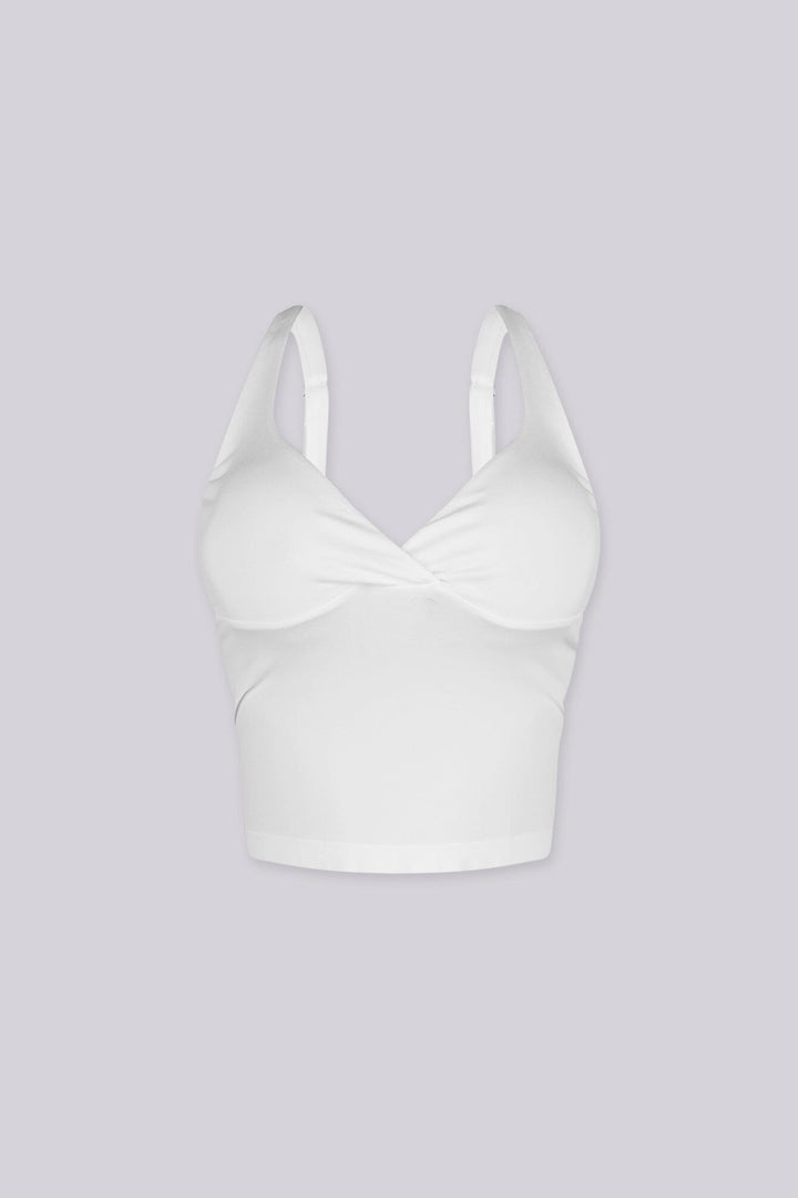Cropped tank top featuring a flattering sweetheart neckline and padded bustier with adjustable straps