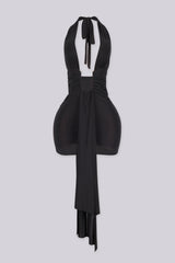Plunging halter neckline mini dress with a long statement draping tail, Fitted ruched bodice gathers into a cinched waist with U shape hardware center front