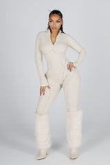 Sleek long sleeve ribbed knit jumpsuit featuring precision stitching and zippered leg details