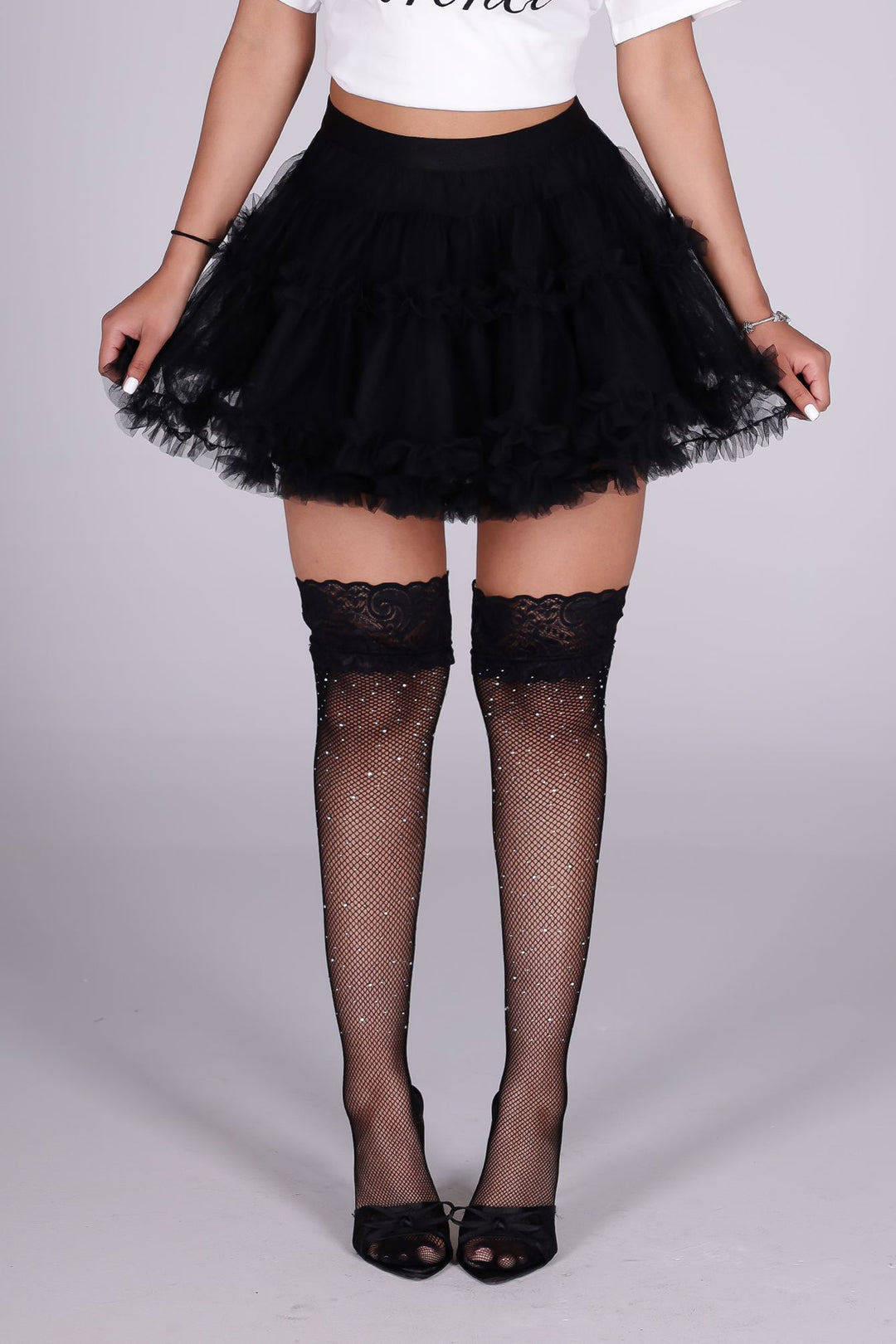 Black fishnet thigh-high stockings with crystal rhinestone accents
Sparkly and perfect for a glam look
Stretchy and comfortable
Built-in silicone grip band