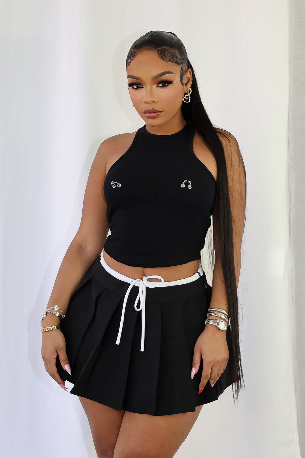 Ribbed high neck crop tank top with racerback featuring silver piercing detail on bust