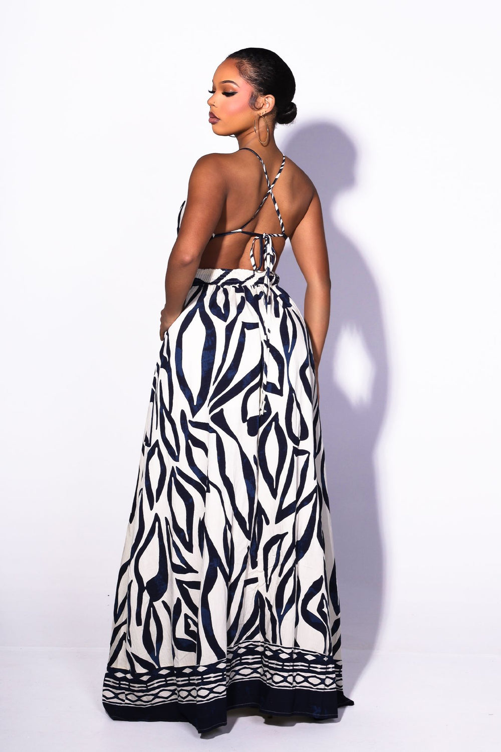 Abstract print summer maxi dress with side high slit for more flowing detail, back view