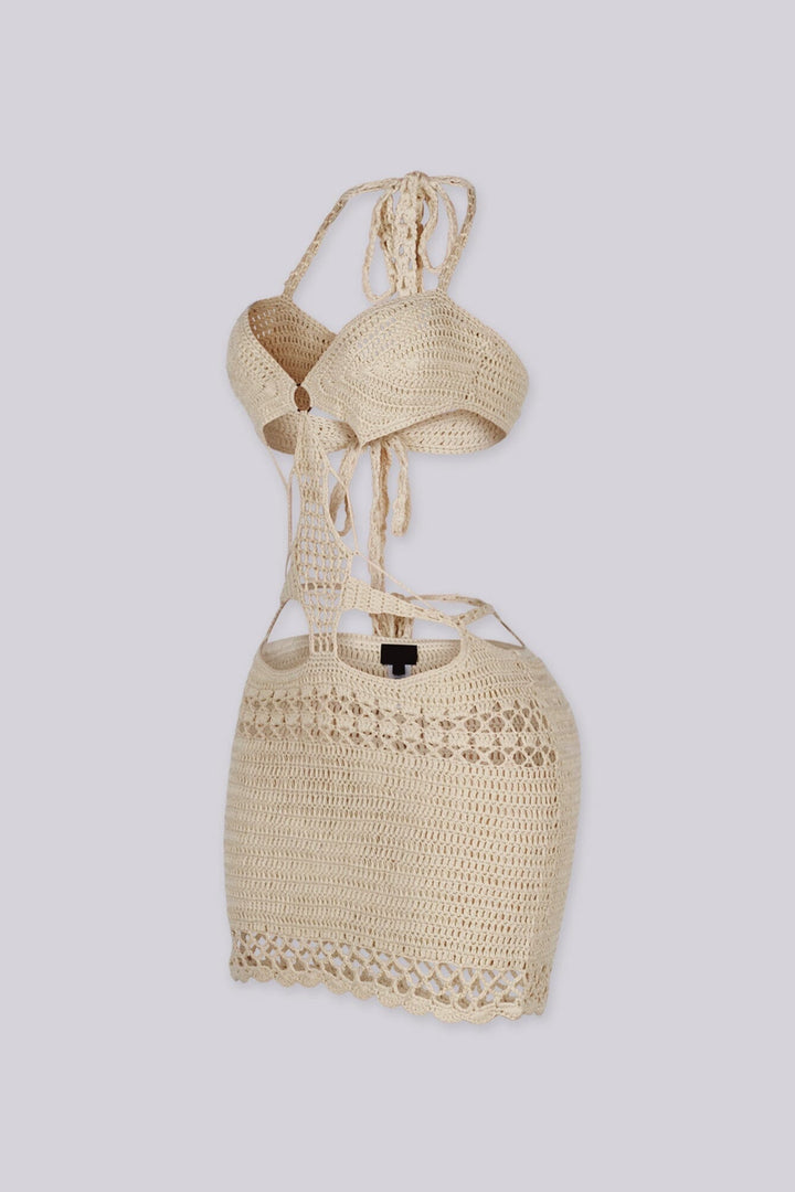 Crochet mini dress featuring a halter neckline and waist cutouts with an O ring detail