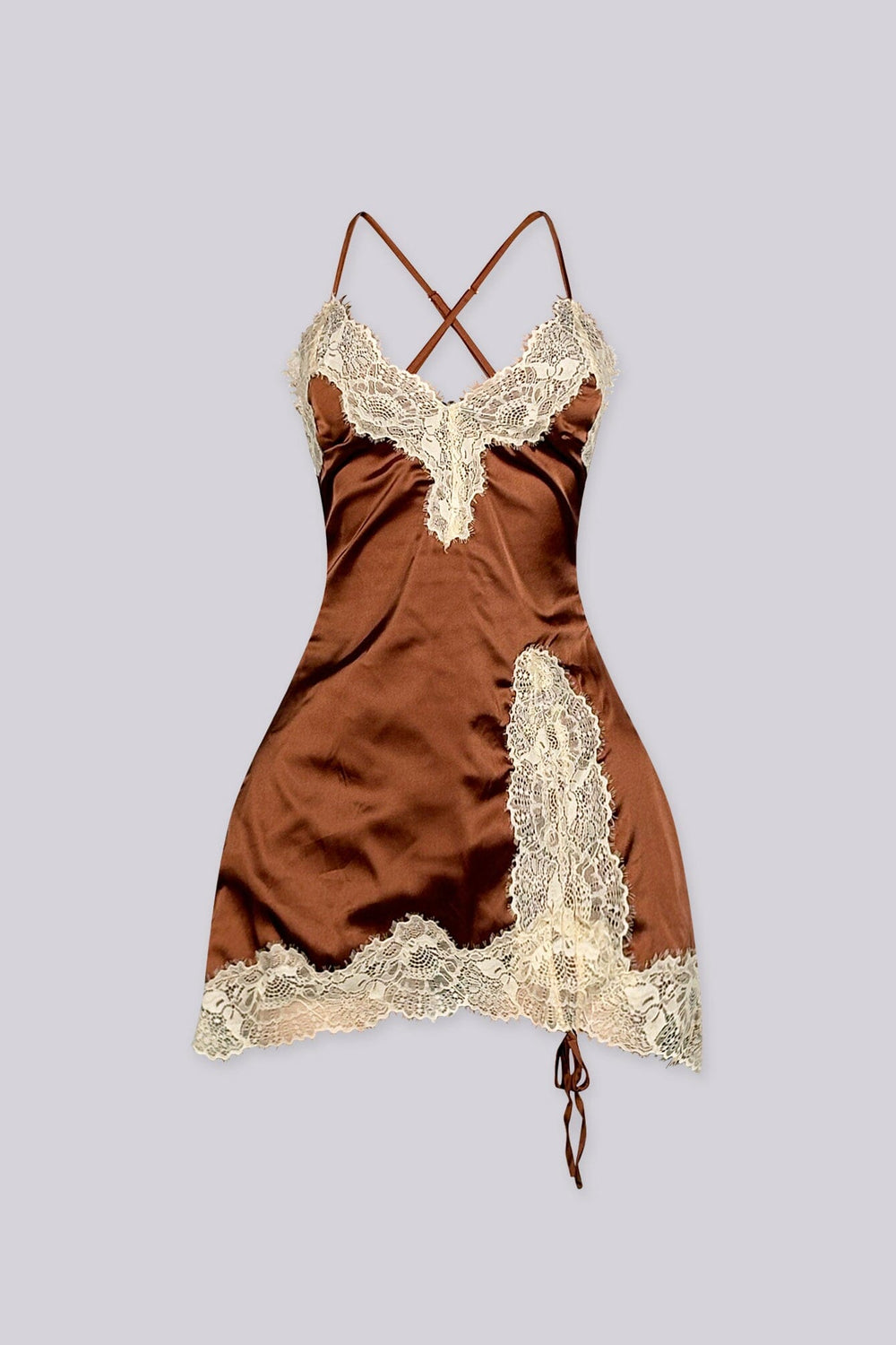 Satin fitted mini slip dress with spaghetti straps featuring lace applique along the bodice and asymmetrical hem
