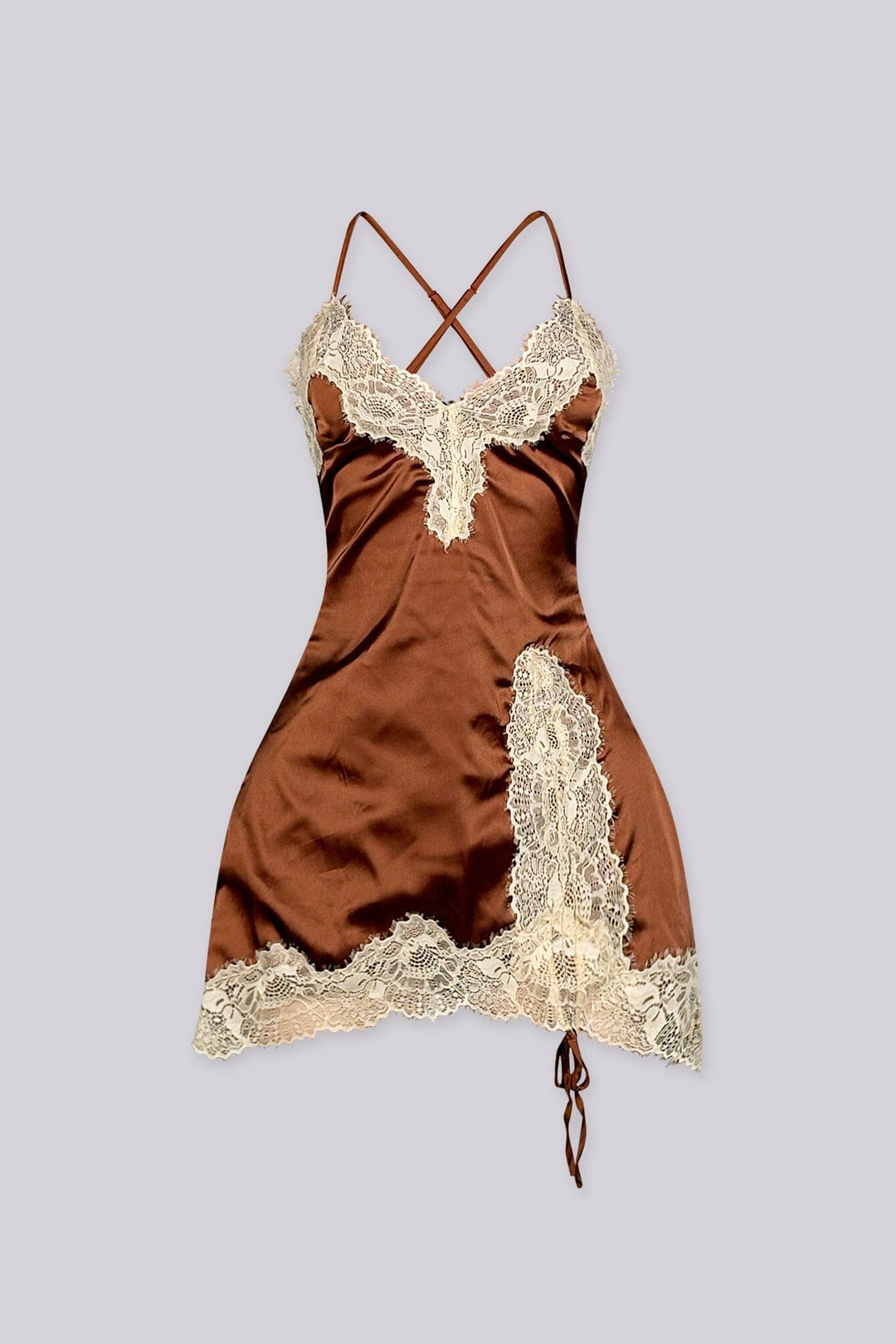 Satin fitted mini slip dress with spaghetti straps featuring lace applique along the bodice and asymmetrical hem