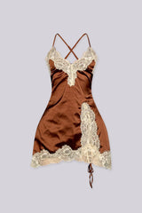 Satin fitted mini slip dress with spaghetti straps featuring lace applique along the bodice and asymmetrical hem
