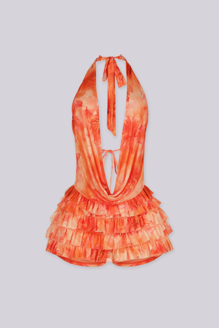 Orange floral romper featuring a halter top and tiered ruffle detailing,
Open back with self-tie closure