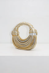 EDGE — gold and silver ribbed half-moon top-handle bag, front view flat lay