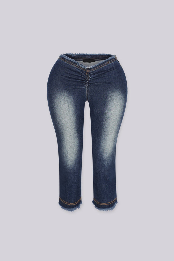 Slim fit low rise denim capri with frayed hem, Waistband dips into a deep V at the center front featuring raw edge finish