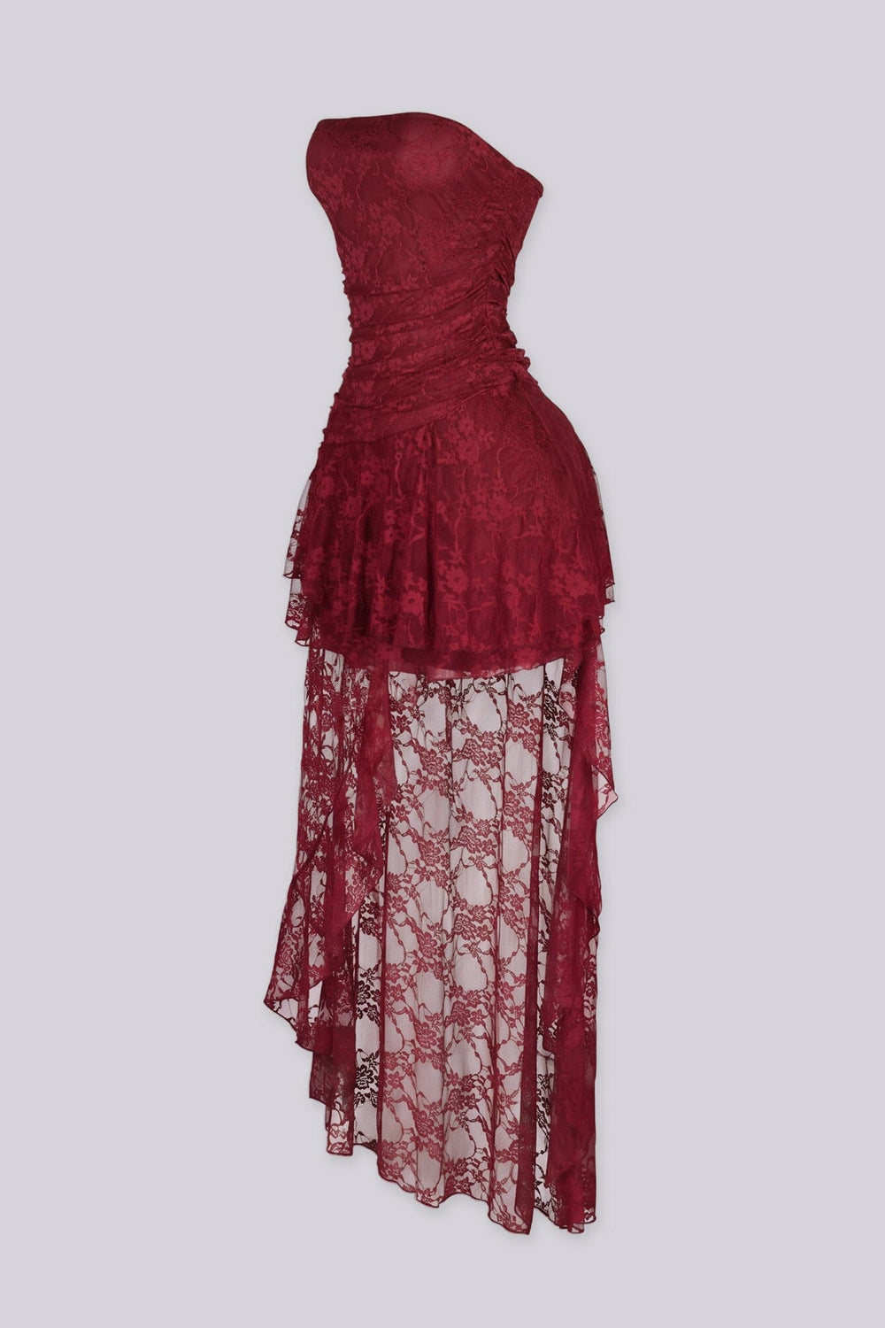Sheer floral lace dress with draped ruched bodice gathering across the bust and tiered ruffle lace overlay drops from the hip in cascading layers
