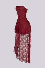 Sheer floral lace dress with draped ruched bodice gathering across the bust and tiered ruffle lace overlay drops from the hip in cascading layers