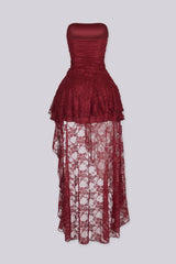 Sheer floral lace dress with draped ruched bodice gathering across the bust and tiered ruffle lace overlay drops from the hip in cascading layers
