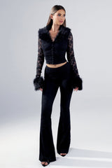 Ruched bodice lace crop top with a faux fur collar and cuffs featuring unlined lace sleeves and a front hook closure