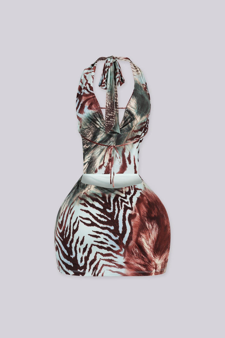 Animal print halter mini dress with deep draped cowl neckline featuring beads charm center connector
