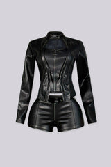 Cropped moto jacket with a stand collar and snap closure featuring princess seams and a front zipper with charm pull