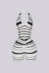 Striped knit halter romper with a deep plunge neckline
Open back with crisscross lace-up detailing closure
