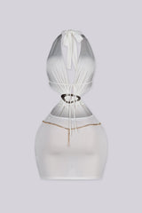 Plunging halter mini dress with dramatic side cut-outs
Asymmetrical gold ring detail with edgy gold chain around the neck