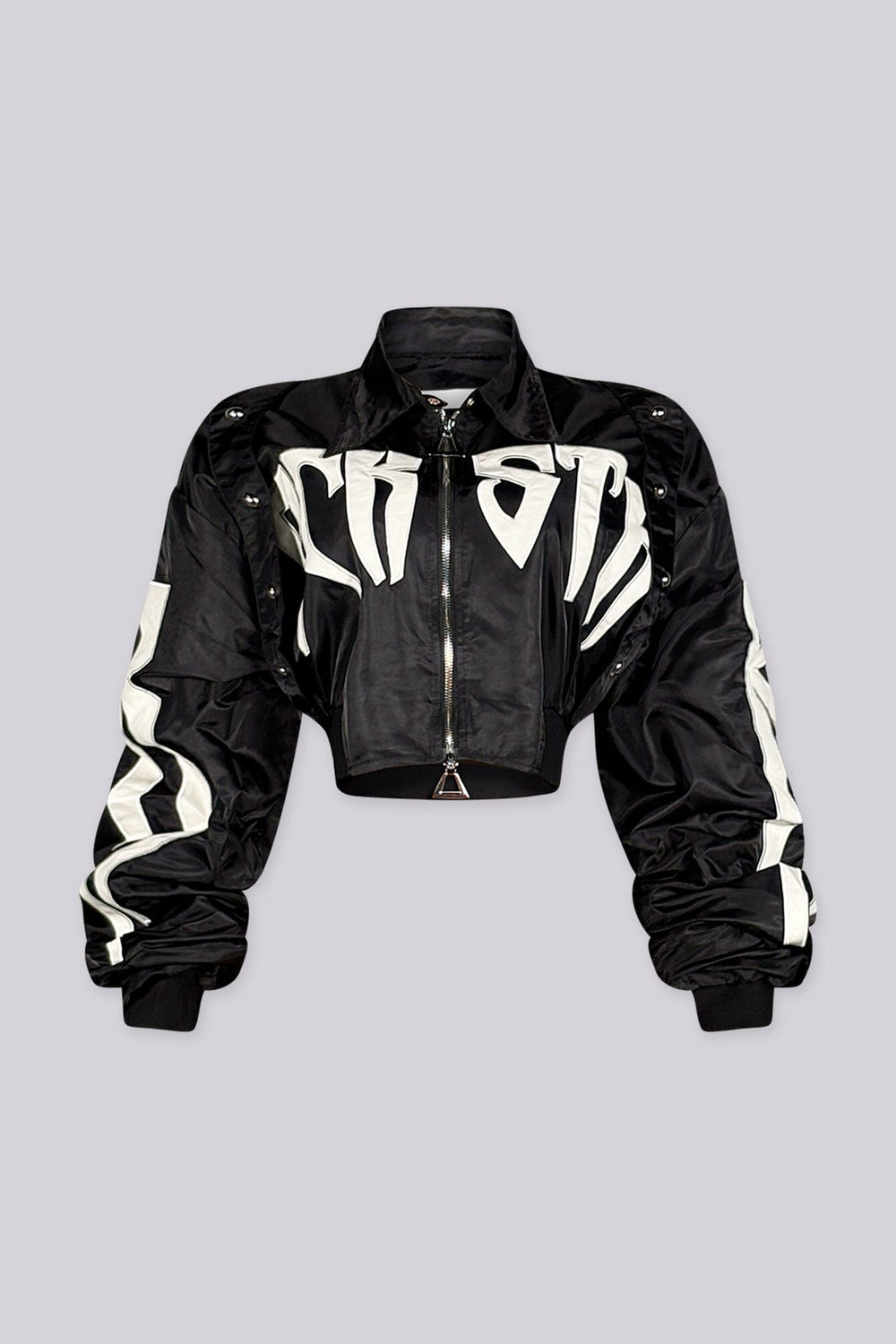 Cropped bomber jacket with a collared snap button placket featuring graphic lettering print and heavily ruched sleeve detail