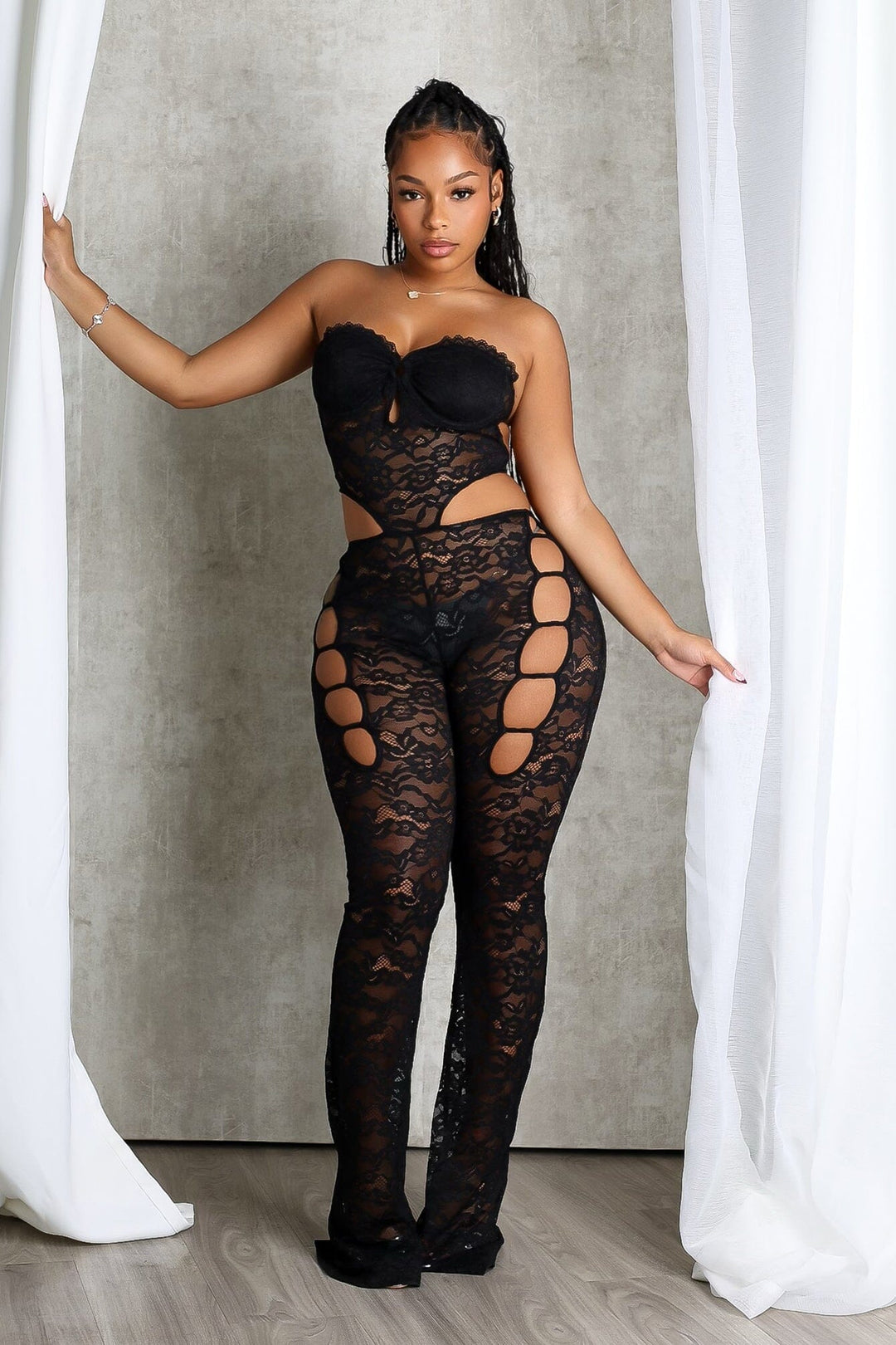 Lace tube jumpsuit with a bustier design featuring back clasp closures and side cutouts