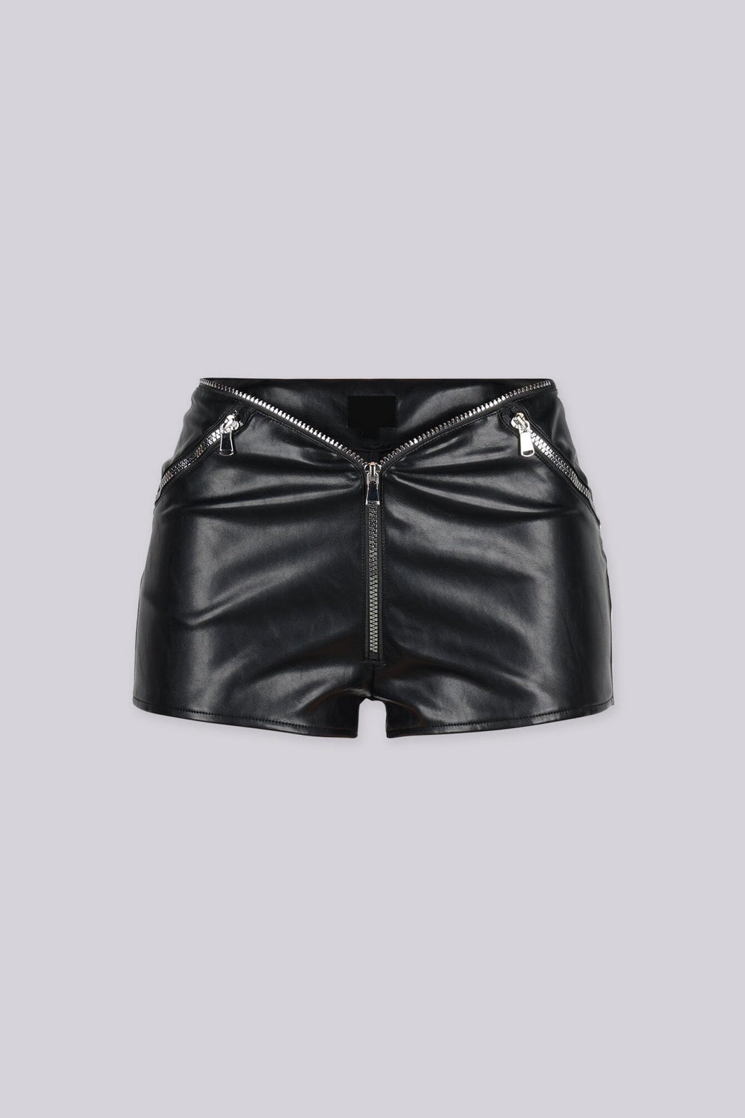 Glossy faux leather shorts with exposed zipper trim runs along the waistline and pockets