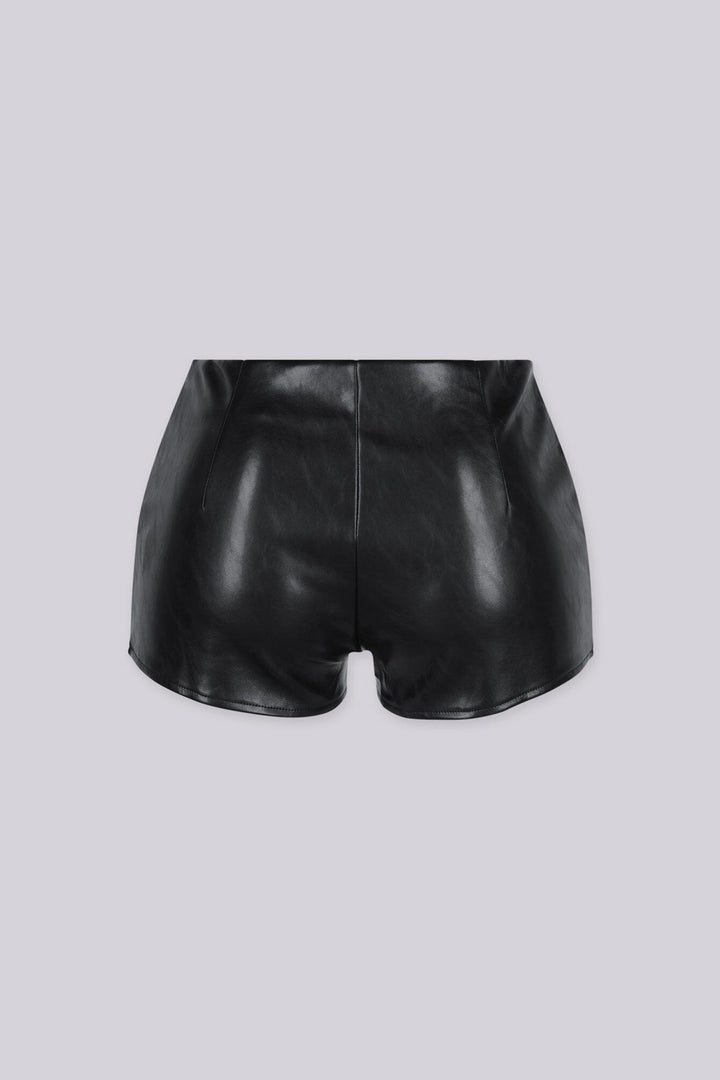 Glossy faux leather shorts with exposed zipper trim runs along the waistline and pockets
