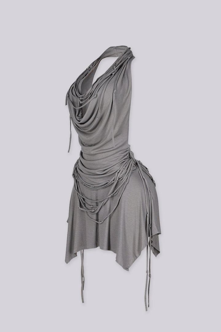High drape halter mini dress with deep plunging cowl neckline
Layering of knotted fabric ropes cascading down the front with asymmetric handkerchief hemline