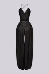 Halter neck jumpsuits with semi sheer mesh wide leg pants featuring gathering at the ankles
Open back with crisscross lace-up closure