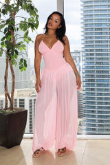 Halter neck jumpsuits with semi sheer mesh wide leg pants featuring gathering at the ankles
Open back with crisscross lace-up closure