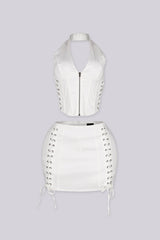 Cropped halter top with lace up panel at the sides featuring metal zipper closure at center front
Paired with a matching mini skirt with lace up panel at the sides
