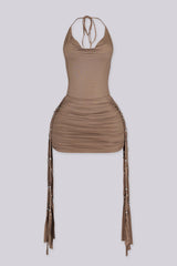 Halter tie neck mini dress with deep cowl neckline
Ruched drape silhouette with open back detail
Beaded fringe hem for statement movement