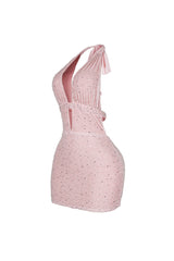 Bodycon halter mini dress with deep plunging vertical keyhole cutout featuring glowing beaded scales throughout