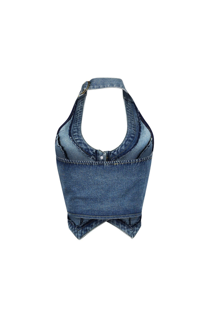 Cropped halter denim vest with deep scoop neckline featuring adjustable neck strap with buckle