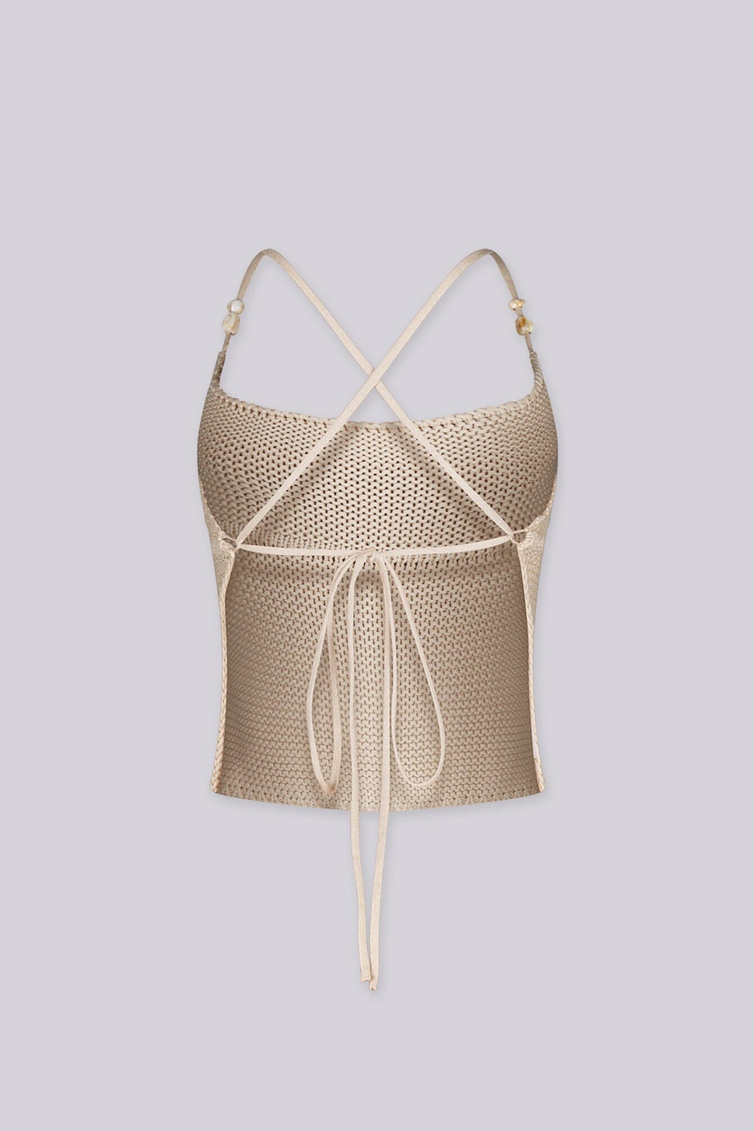 Textured knit halter crop top with adjustable tie-back straps with beads detail
Open back with crisscross tie closure